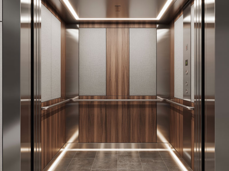 Modern elevator interior with wood paneling, brushed metal accents, gray fabric panels, tile floor, and ceiling and floor lighting strips.