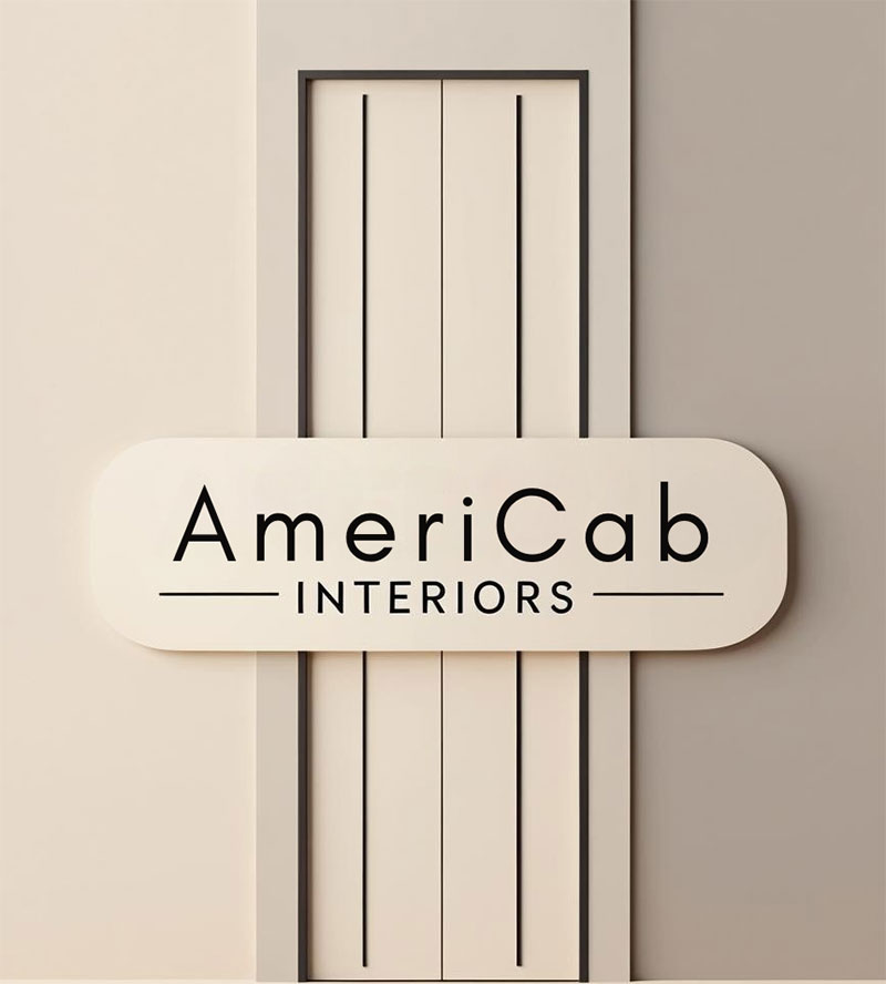 A sign reading "AmeriCab INTERIORS" is mounted on a beige wall with vertical decorative panels.