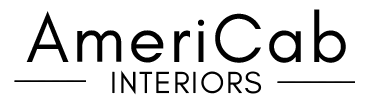 The image shows the AmeriCab Interiors logo with "AmeriCab" in large black letters and "INTERIORS" below in smaller letters, flanked by horizontal lines.